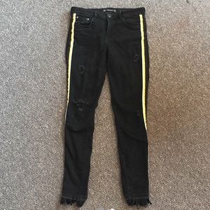black jeans with yellow stripe